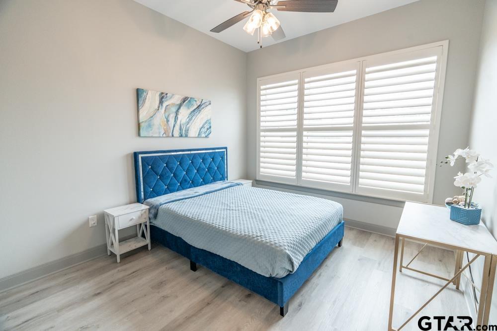 3531 Chapel View Tyler, TX 75707 - Photo 26 of 48 a bed sitting in a bedroom next to a window