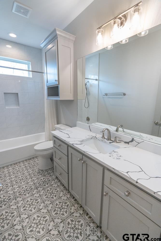 3531 Chapel View Tyler, TX 75707 - Photo 32 of 48 a bathroom with a double vanity sink mirror and toilet