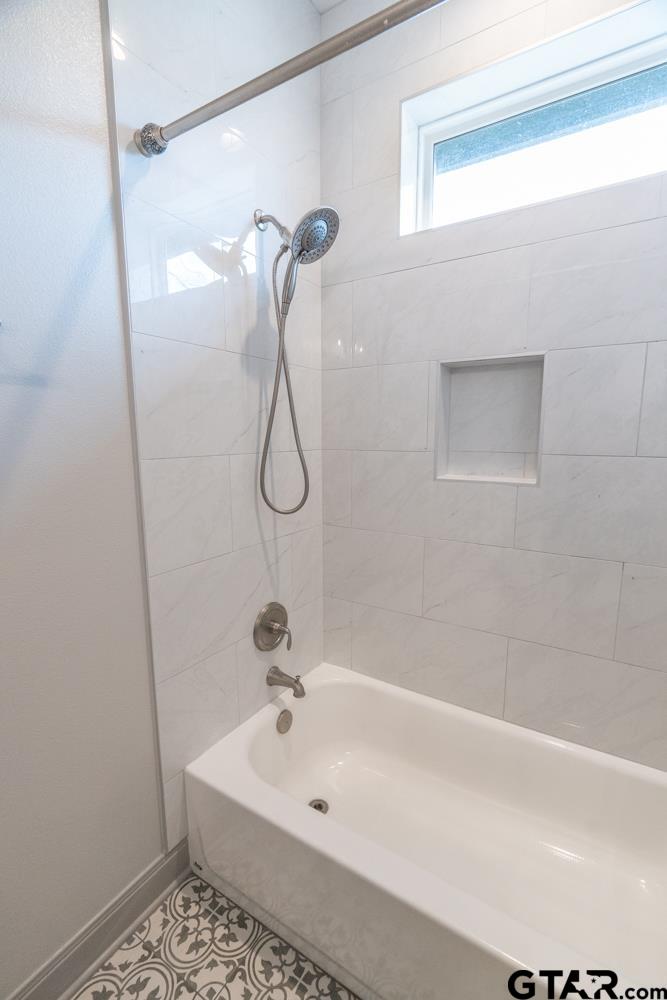 3531 Chapel View Tyler, TX 75707 - Photo 33 of 48 a bathroom with a sink a mirror and a shower