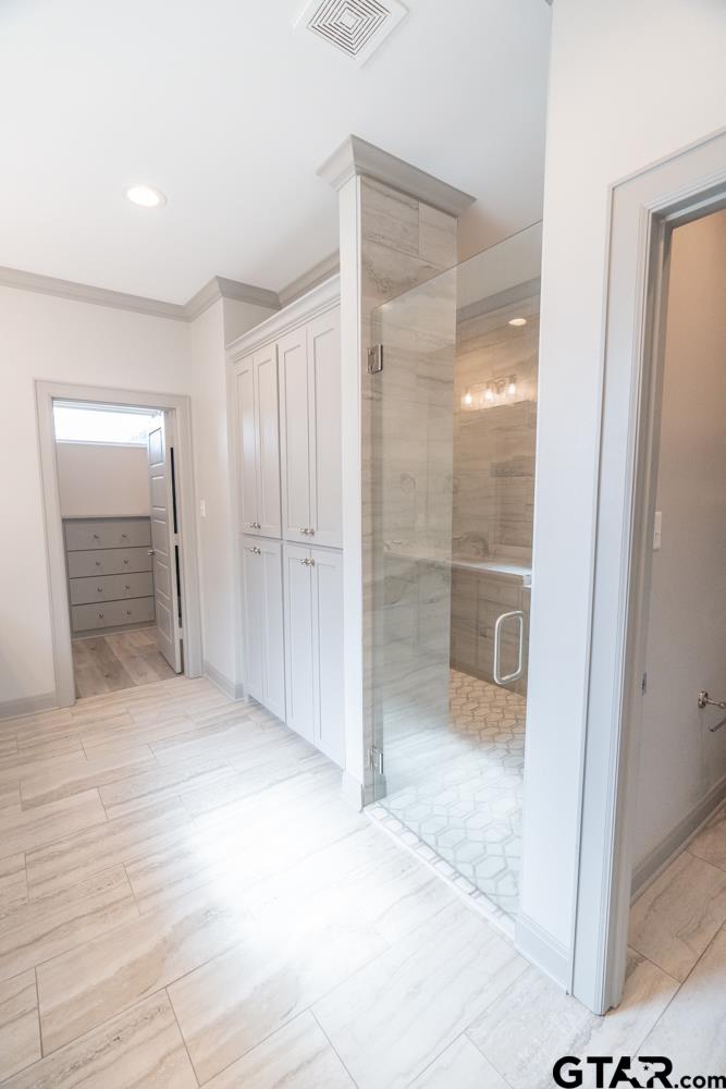 3531 Chapel View Tyler, TX 75707 - Photo 38 of 48 a bathroom with a glass shower door