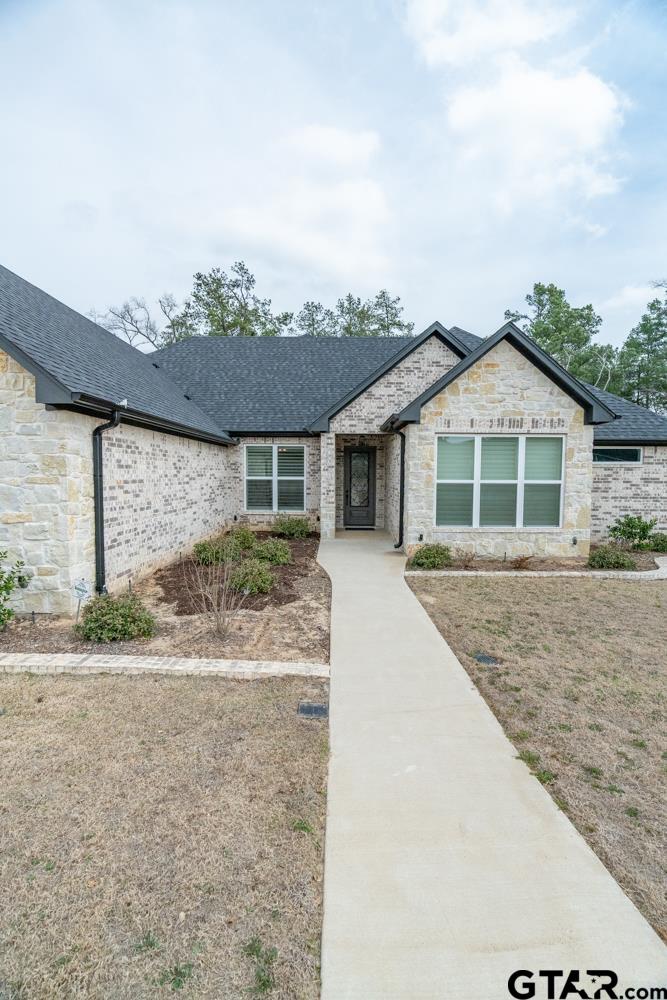 3531 Chapel View Tyler, TX 75707 - Photo 6 of 48 a front view of a house with a yard and garage