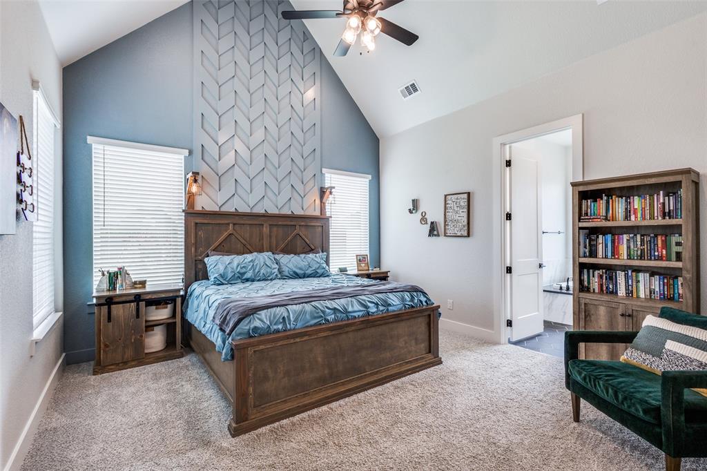 2255 County Road 377 Van Alstyne, TX 75495 - Photo 14 of 35 a spacious bedroom with a bed a table and a bookshelf