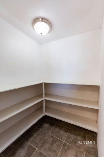 245 North Fairview Street Ridgecrest, CA 93555 - Photo 20 of 23 a view of room with a desk and chair