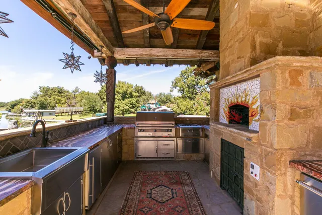 a kitchen with stainless steel appliances granite countertop a stove and a sink