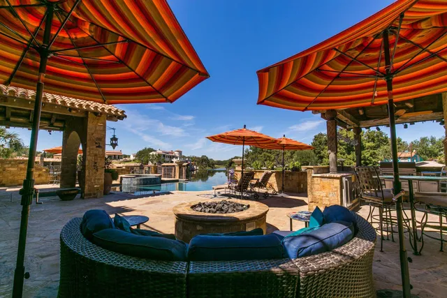 a outdoor space with patio furniture and a umbrella