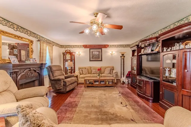a living room with furniture and a flat screen tv
