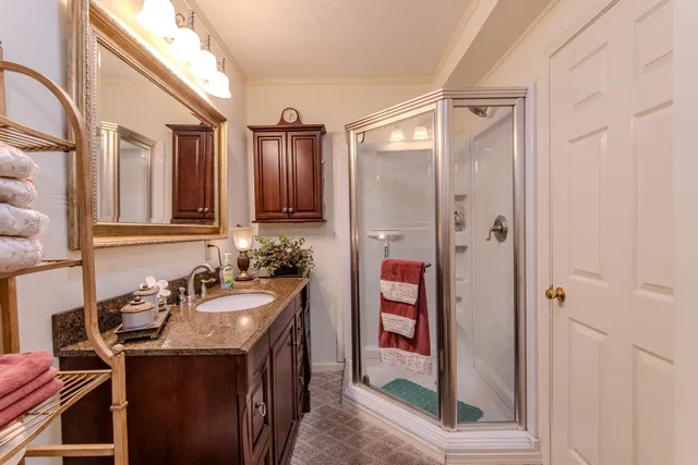 a bathroom with a sink and mirror