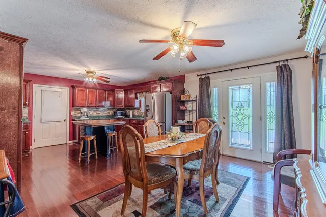 a view of a dining room with furniture window and wooden floor