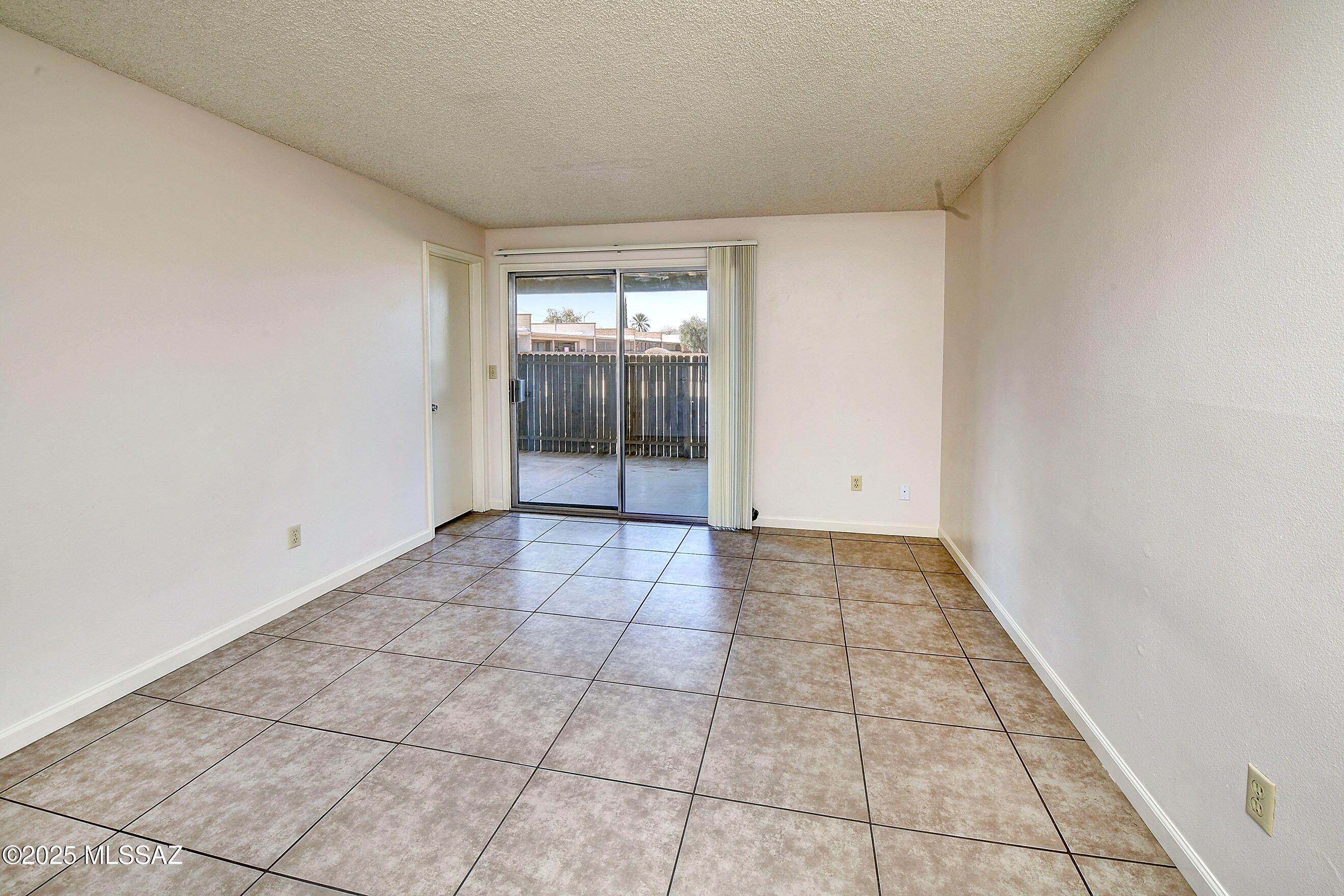 35 East Pastime Road Tucson, AZ 85705 - Photo 10 of 28 a view of an empty room and window