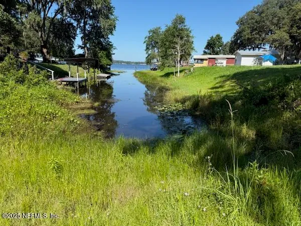 a garden view with a lake view