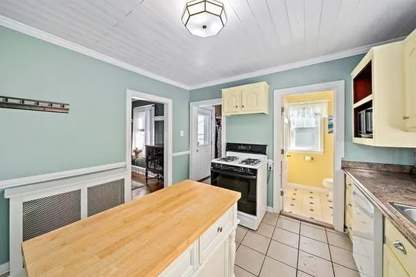 a kitchen with stainless steel appliances granite countertop a stove and a refrigerator