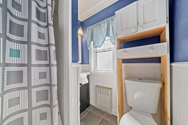a view of an entryway with a kitchen
