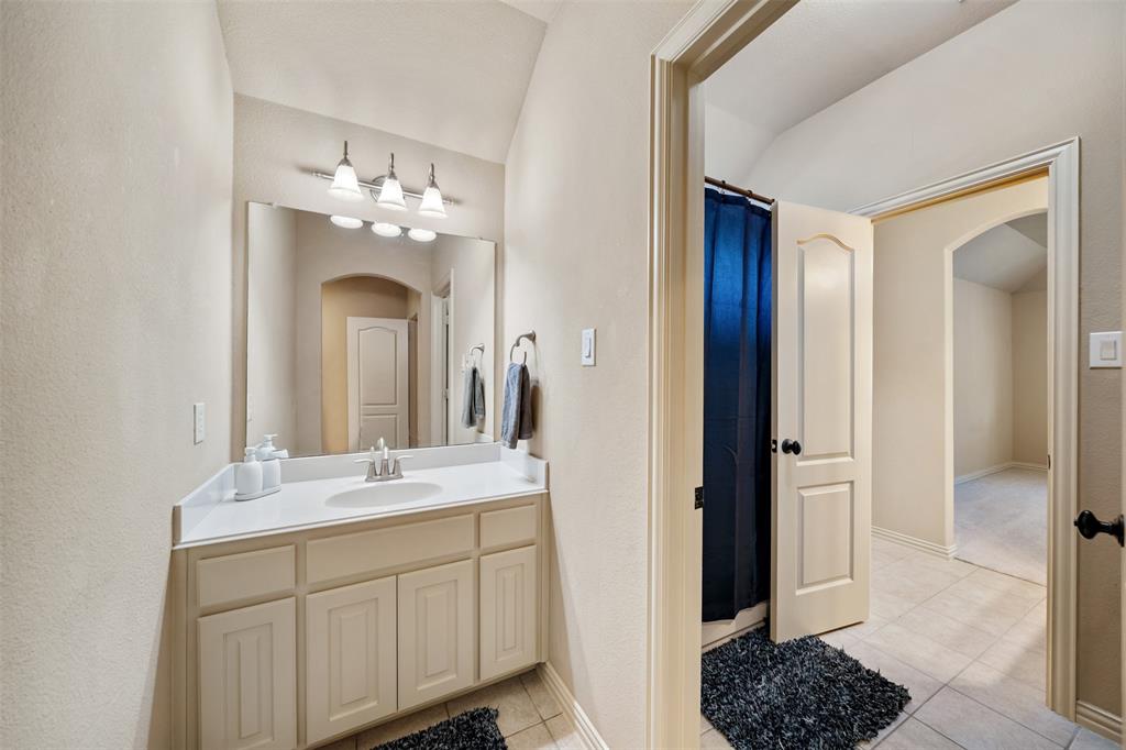 5048 Exposition Way Fort Worth, TX 76244 - Photo 26 of 39 a bathroom with a double vanity sink and a mirror