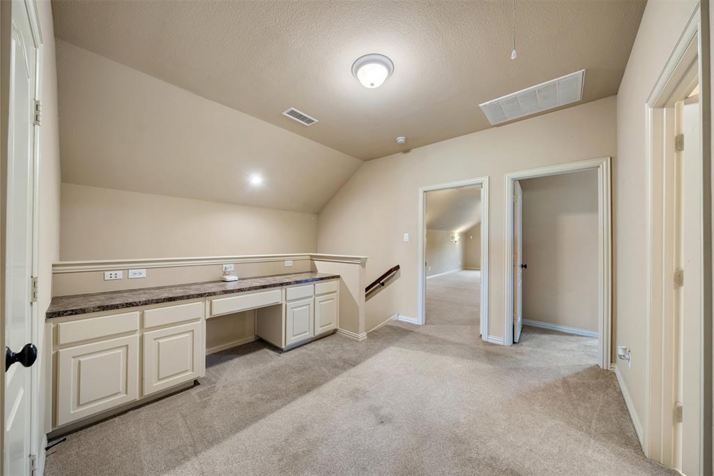 5048 Exposition Way Fort Worth, TX 76244 - Photo 30 of 39 a large white kitchen with a stove a sink a microwave and a refrigerator