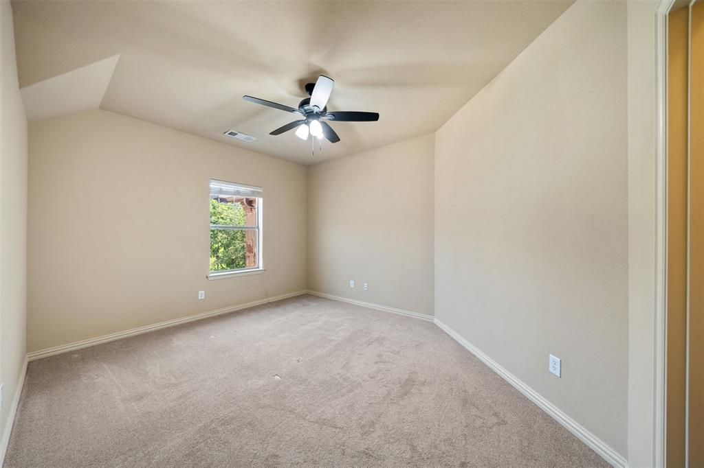 5048 Exposition Way Fort Worth, TX 76244 - Photo 31 of 39 a view of room with a ceiling fan and window