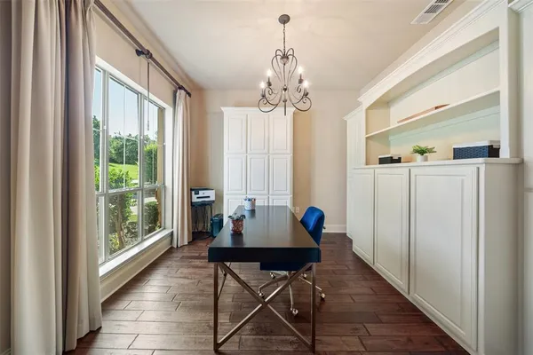 a view of a livingroom with furniture window and wooden floor