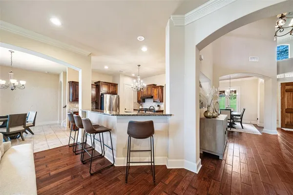 a view of kitchen with dining table and chairs