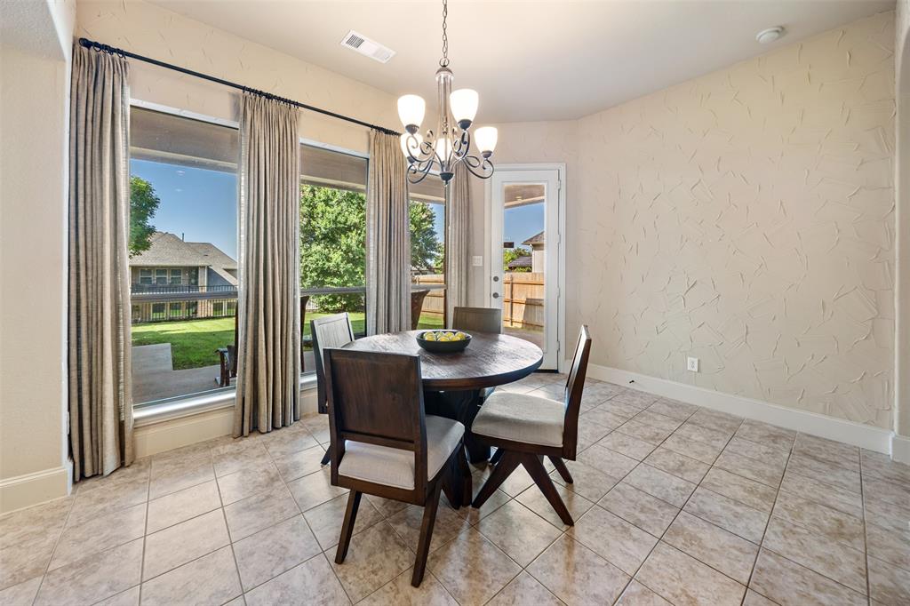 5048 Exposition Way Fort Worth, TX 76244 - Photo 10 of 39 a dining room with furniture a chandelier and window