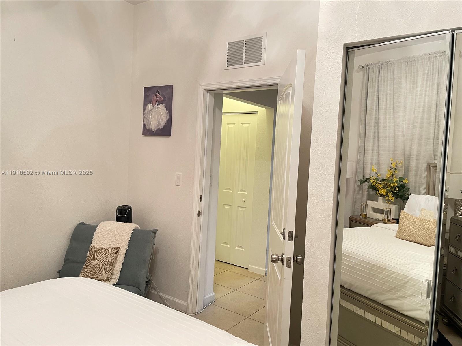 27563 Southwest 139th Place, Unit B Homestead, FL 33032 - Photo 11 of 17 a bathroom with a bathtub