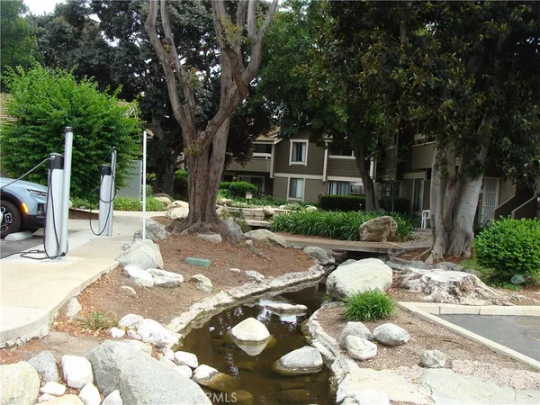 a view of a backyard with sitting area