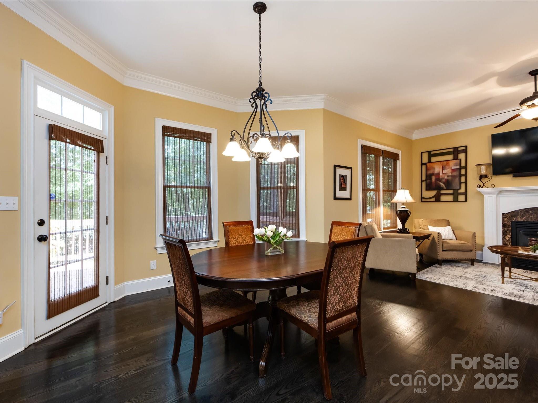 132 Chaska Loop Troutman, NC 28166 - Photo 13 of 48 a dining room with furniture window and wooden floor