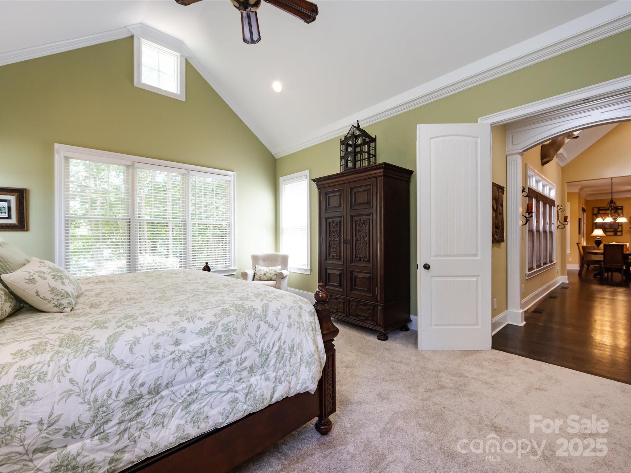 132 Chaska Loop Troutman, NC 28166 - Photo 15 of 48 a bedroom with a bed dresser and a large window