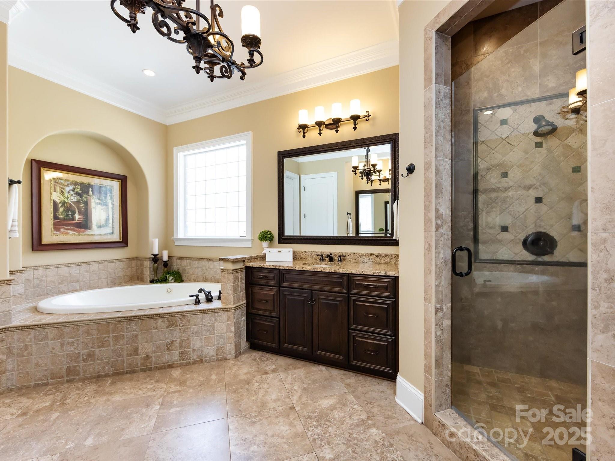 132 Chaska Loop Troutman, NC 28166 - Photo 20 of 48 a spacious bathroom with a tub sink and mirror