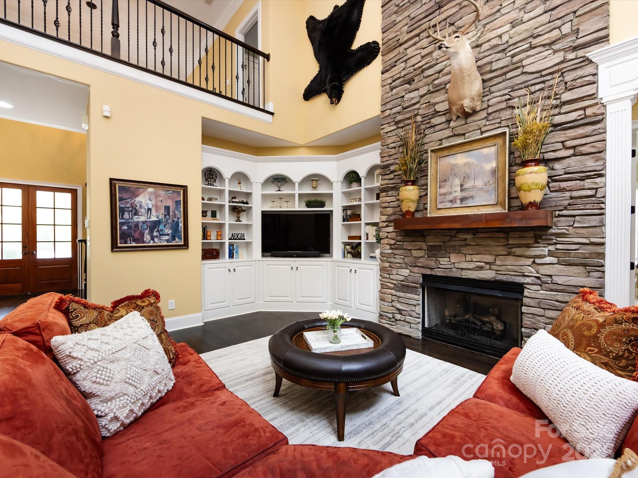132 Chaska Loop Troutman, NC 28166 - Photo 23 of 48 a living room with furniture and a fireplace
