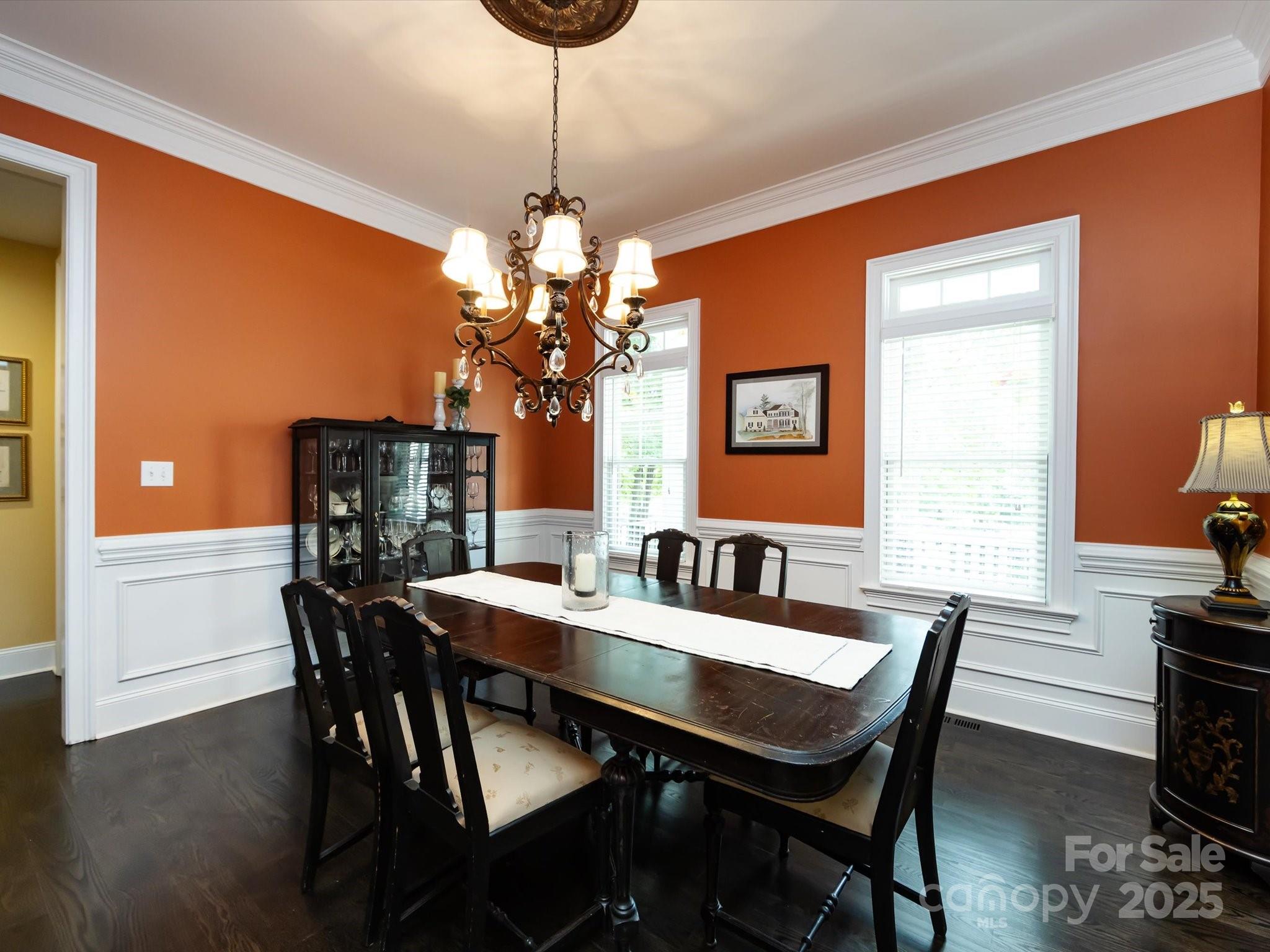 132 Chaska Loop Troutman, NC 28166 - Photo 25 of 48 a view of a dining room with furniture window and wooden floor