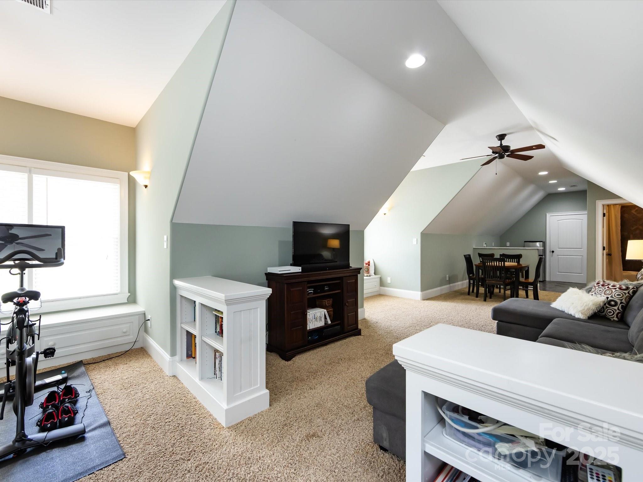 132 Chaska Loop Troutman, NC 28166 - Photo 34 of 48 a living room with furniture and a flat screen tv