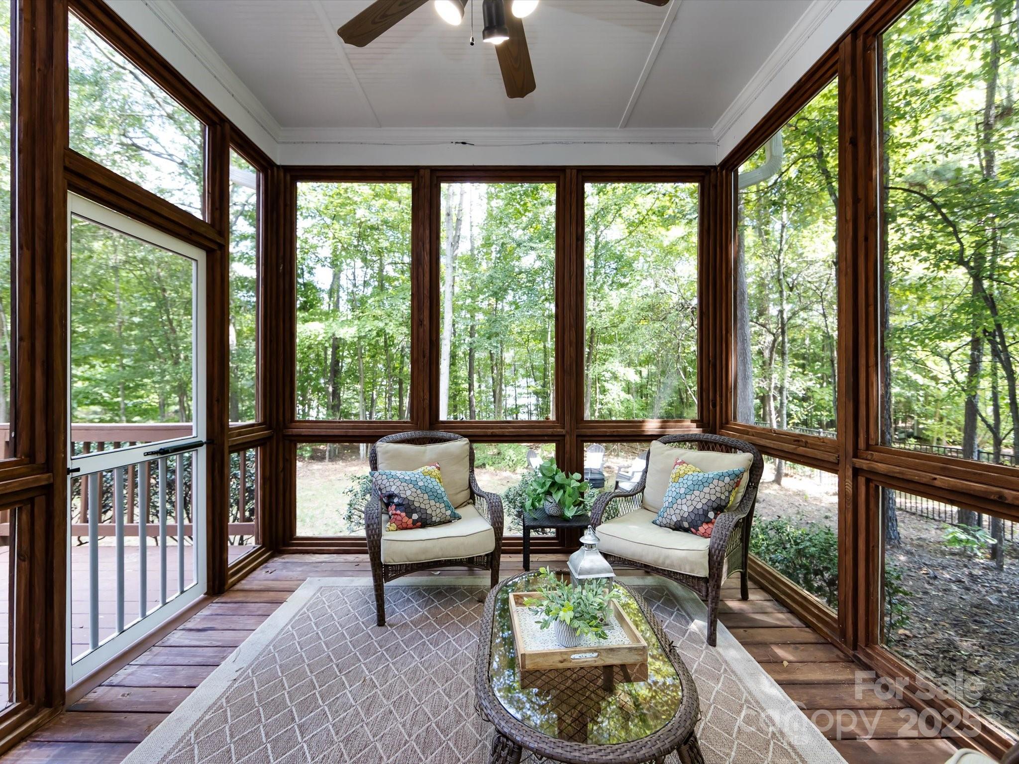 132 Chaska Loop Troutman, NC 28166 - Photo 43 of 48 a living room with furniture and a floor to ceiling window