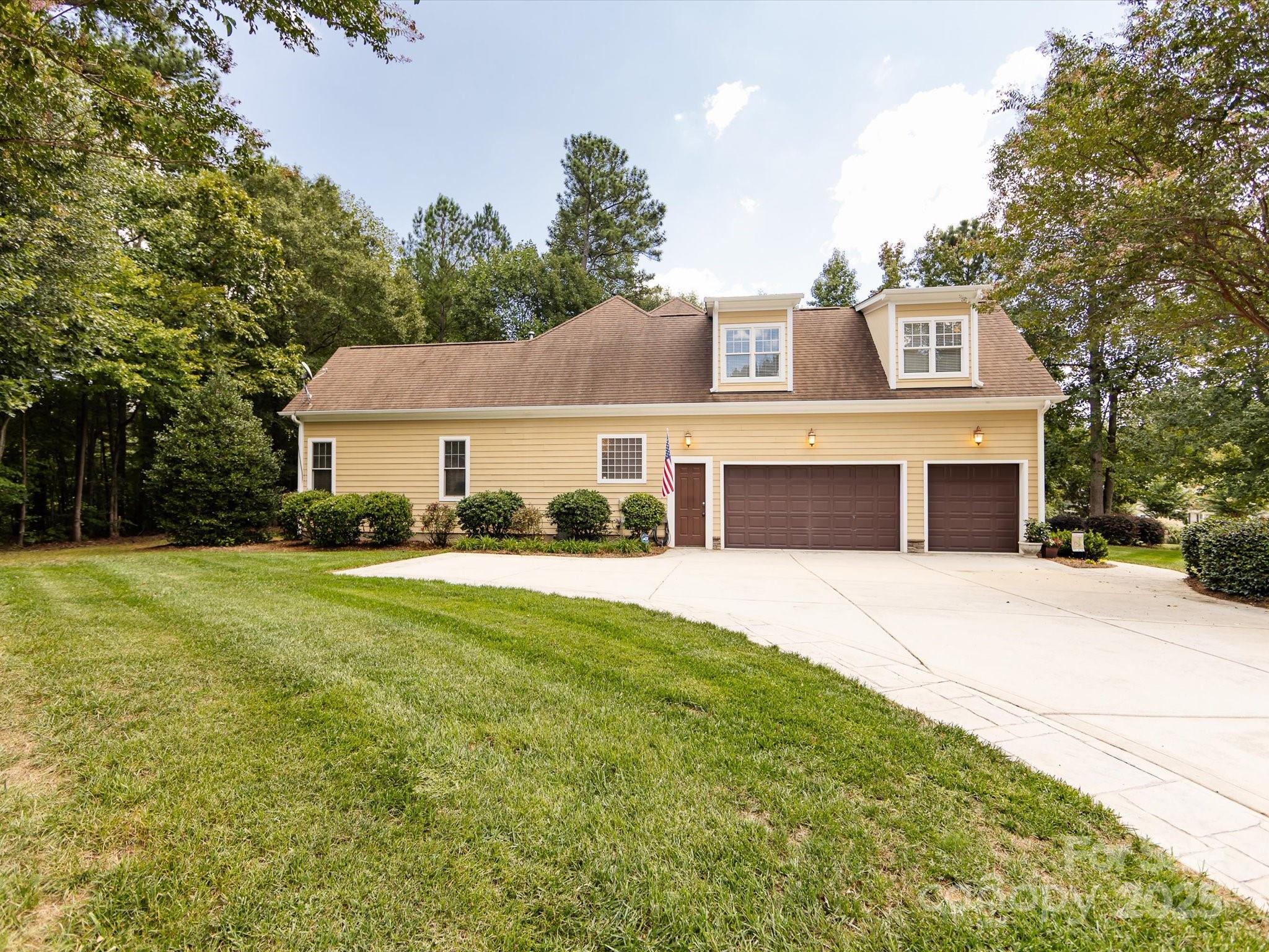 132 Chaska Loop Troutman, NC 28166 - Photo 45 of 48 a front view of a house with a yard