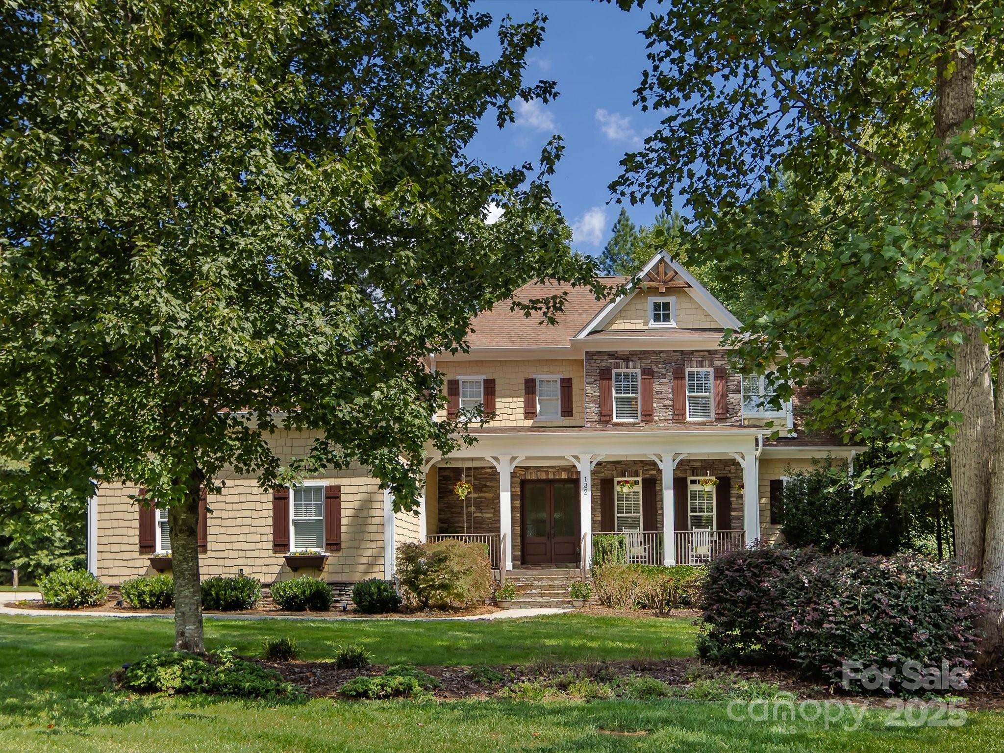 132 Chaska Loop Troutman, NC 28166 - Photo 47 of 48 a front view of a house with a garden