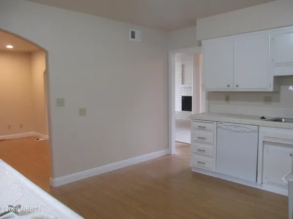 a view of cabinets and window
