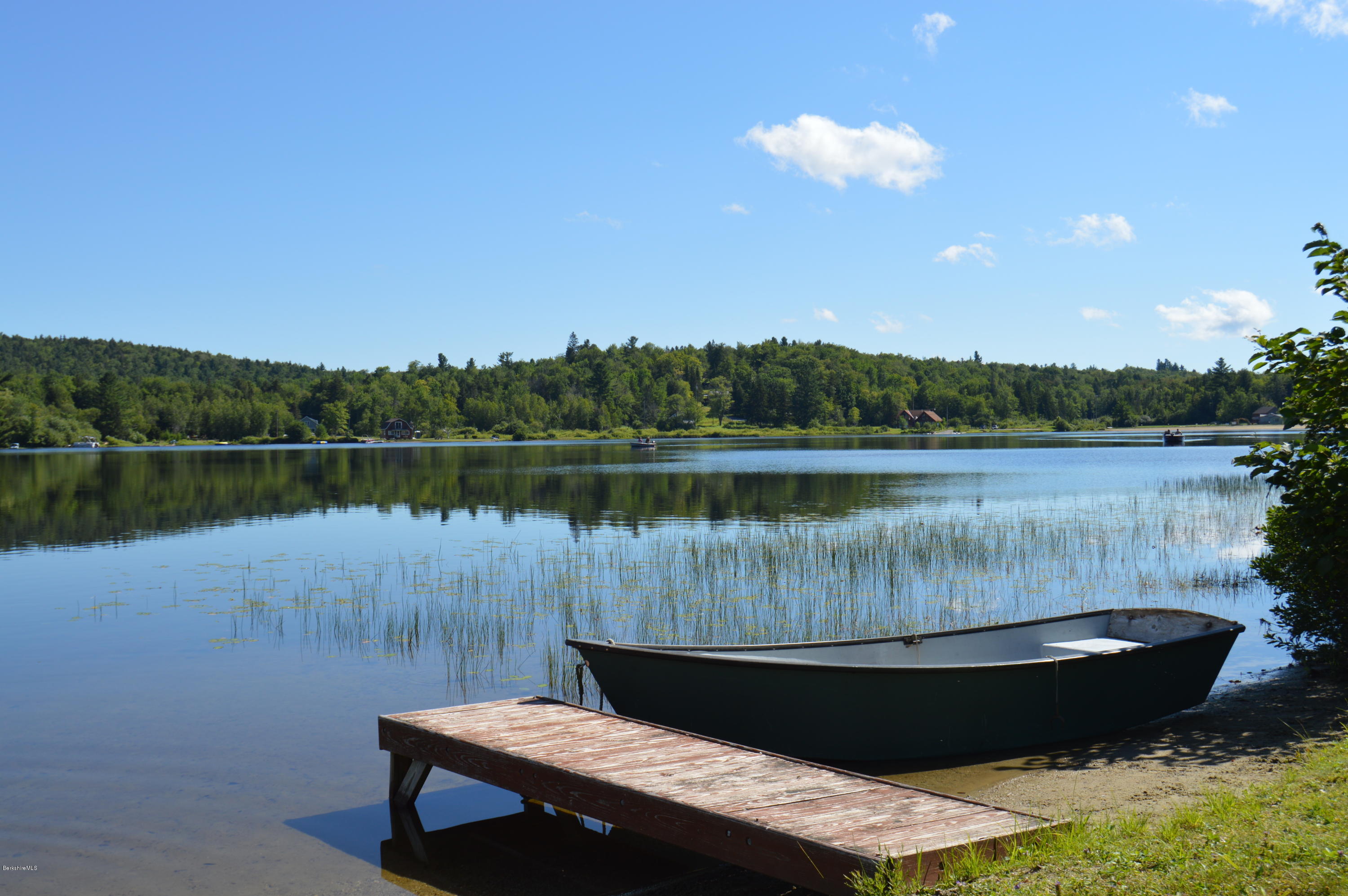 85-86 Windsor Pond Road Windsor, MA 01270 - Photo 3 of 22 a view of a lake with a house in the background