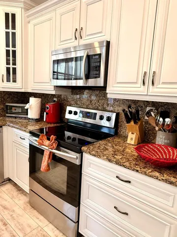 a view of a balcony with chairs