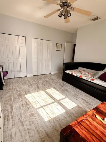 a bathroom with a sink a vanity and a mirror