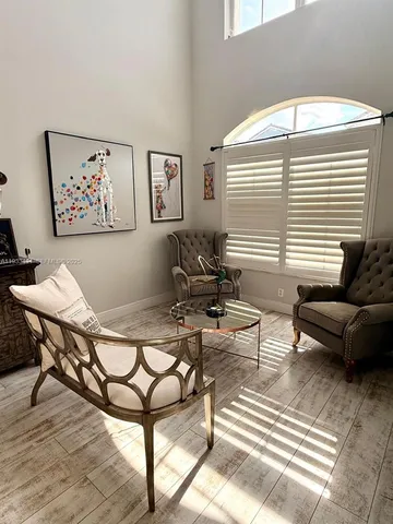 a living room with furniture and a window