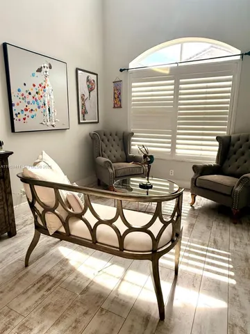 a dining room with furniture and window