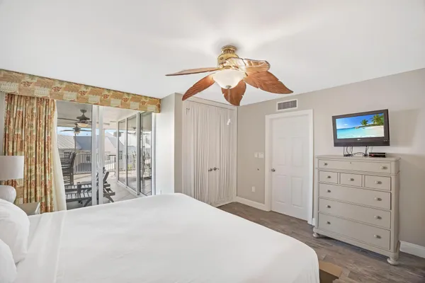 a bathroom with a shower curtain and a window