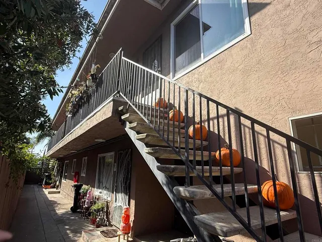 a kitchen with a refrigerator and a sink