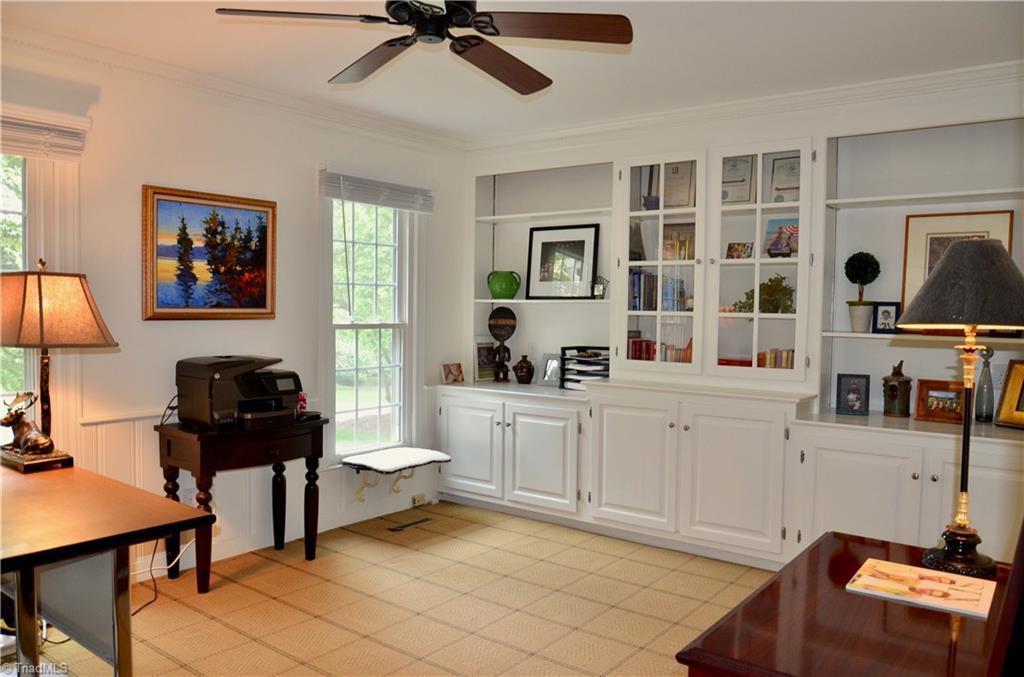 952 Bryanplace Road Winston-Salem, NC 27104 - Photo 12 of 30 Large office (could be guest/5th or master BR)- great built-in wooded cabinets with adjustable shelving and glass doors. Large walk-in closet now used as storage space. Commercial grade carpet.