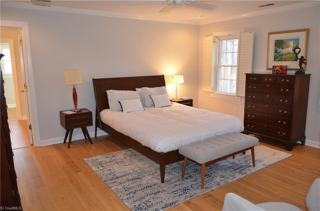 952 Bryanplace Road Winston-Salem, NC 27104 - Photo 17 of 30 Large master BR with crown molding, added recessed lights, ceiling fan, and custom plantation shutter. In 2020: fresh paint and new LVP flooring.