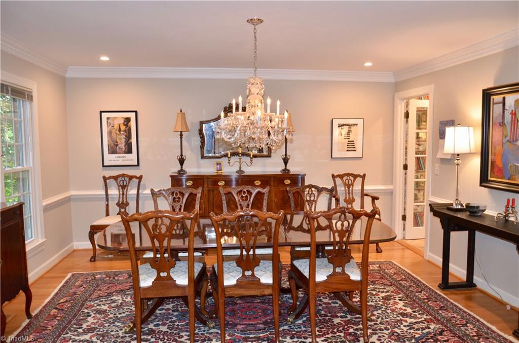 952 Bryanplace Road Winston-Salem, NC 27104 - Photo 4 of 30 Oversized DR with added dental molding, recessed lights added, windows and wood floors were replaced and a french door was added at kitchen. Fresh paint in 2019. Chandelier does not convey.
