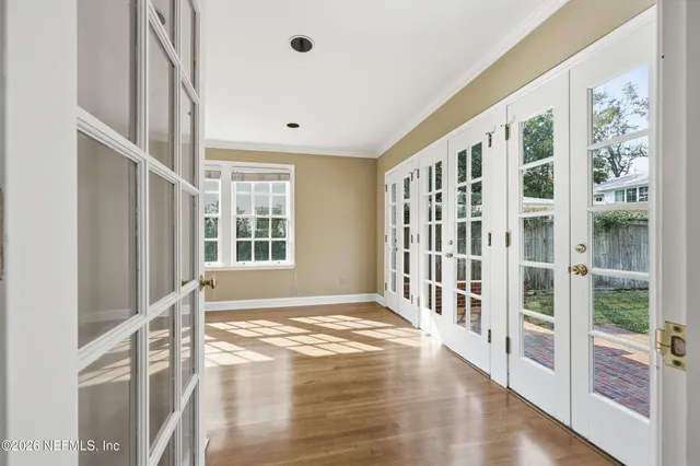 a view of an empty room with windows
