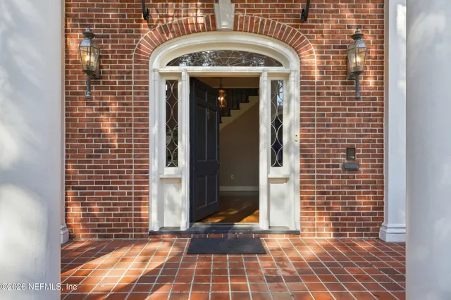 a view of a porch with a floor to ceiling window