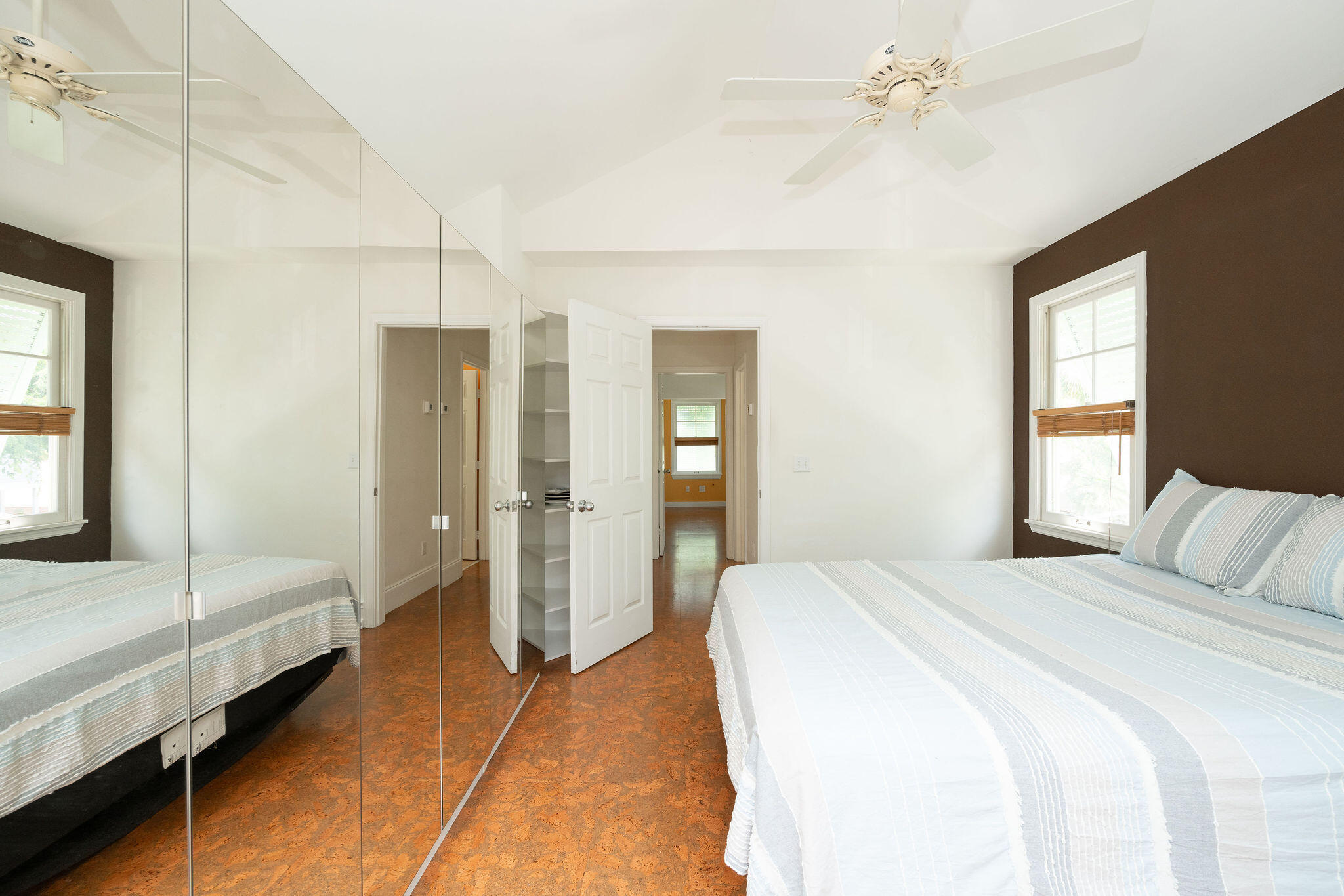 1 Spoonbill Way Key West, FL 33040 - Photo 19 of 38 a bedroom with a bed and a chandelier