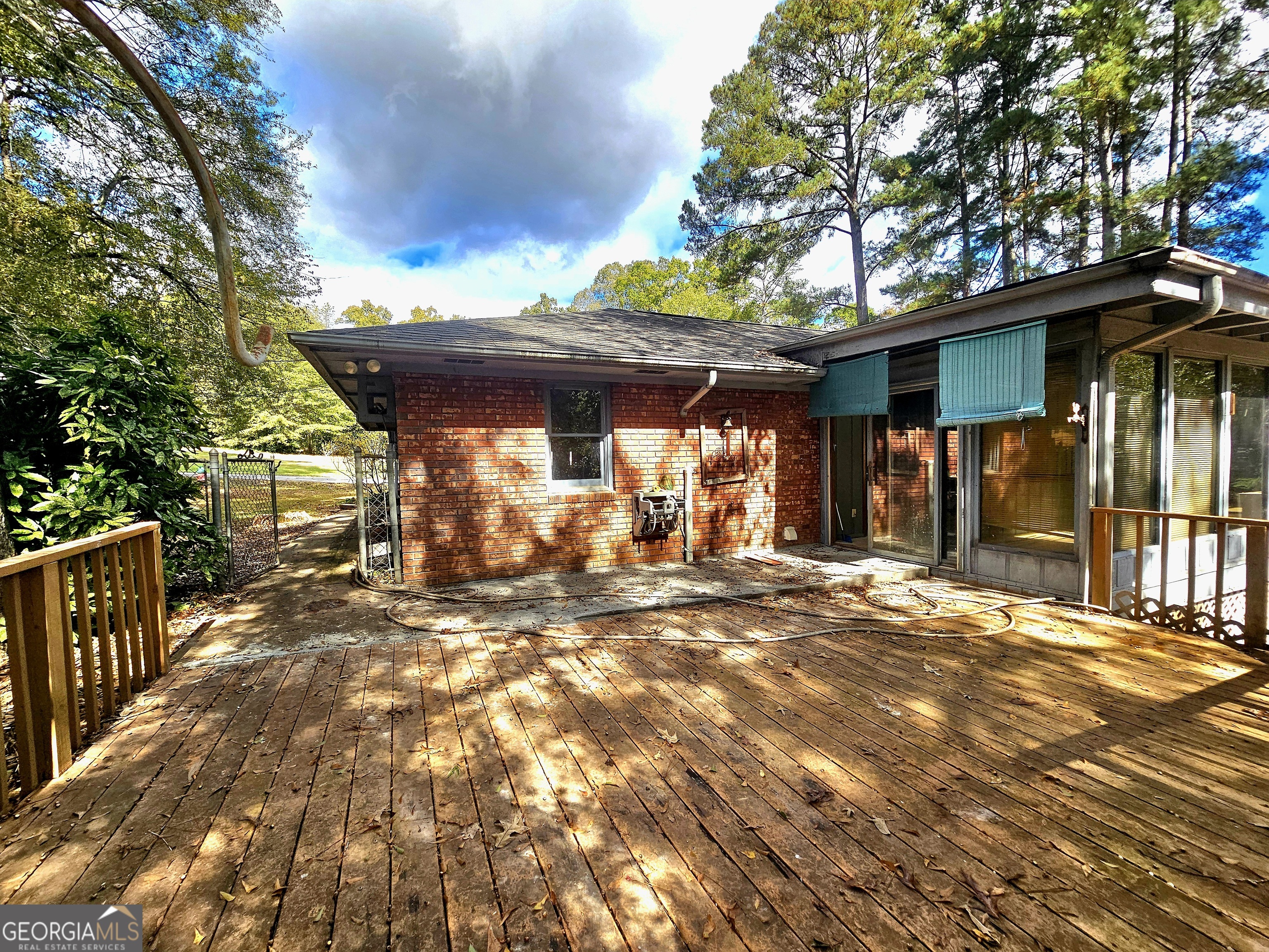 96 Glencrest Drive Toccoa, GA 30577 - Photo 14 of 15 a view of a backyard with table and chairs under an umbrella