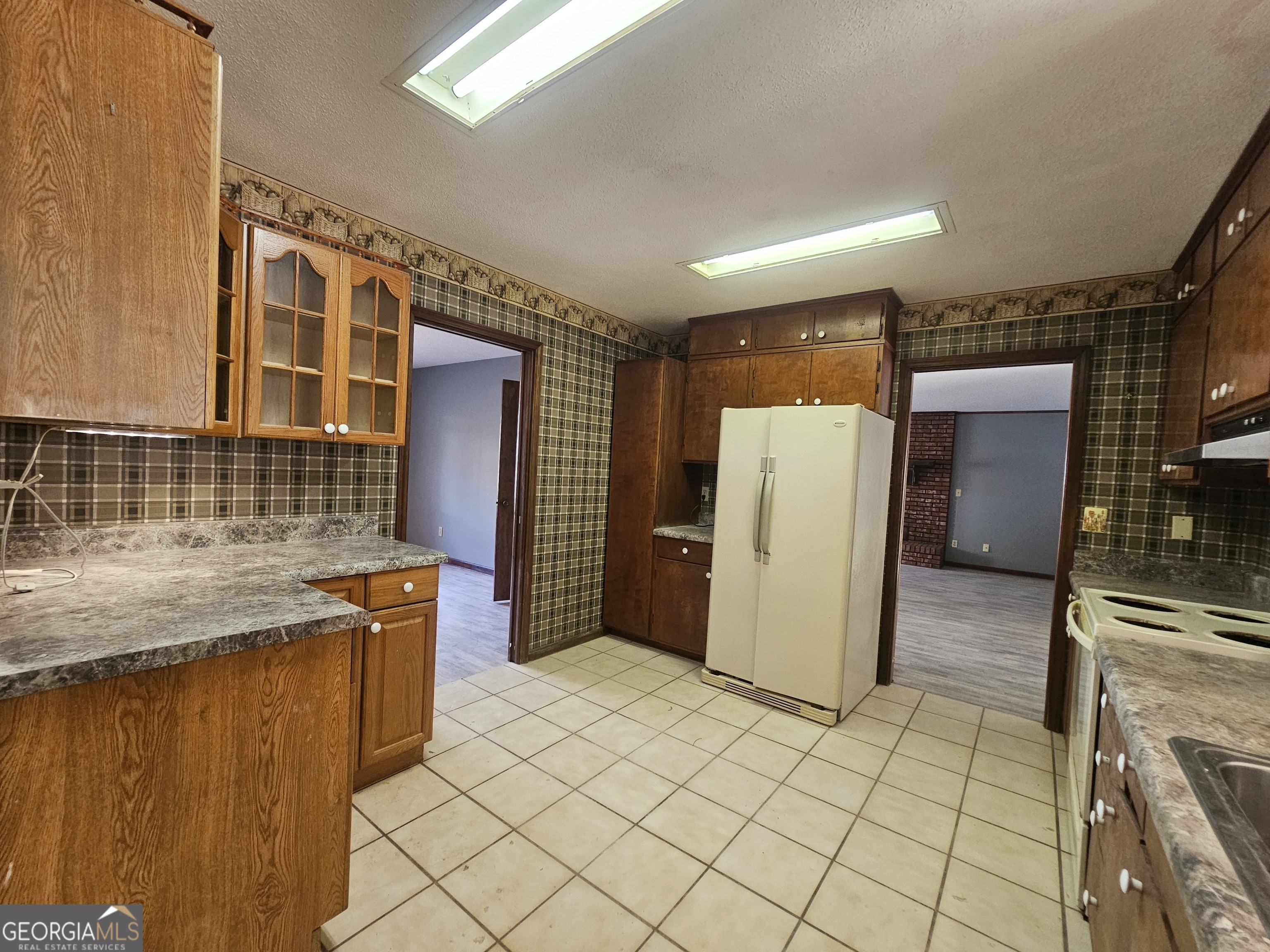 96 Glencrest Drive Toccoa, GA 30577 - Photo 6 of 15 a kitchen with a sink a refrigerator and cabinets
