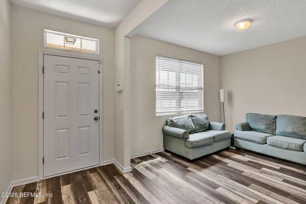 a living room with furniture and a window